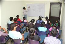 Teacher explaining students